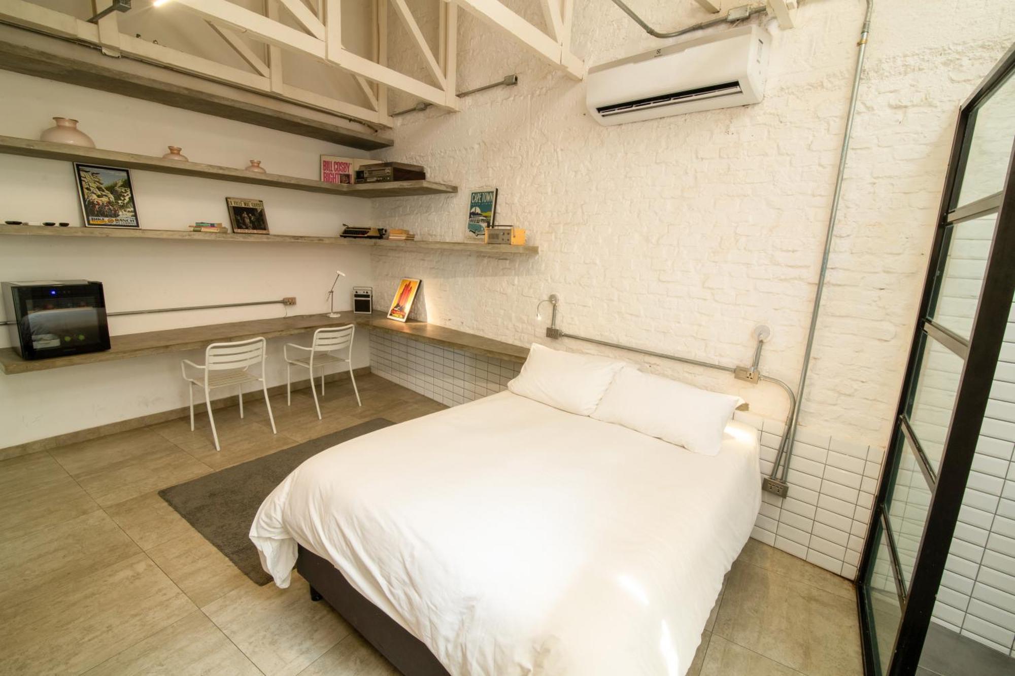 Cosmopolitano Hotel Boutique Santa Cruz de La Sierra Dış mekan fotoğraf A bedroom in a micro apartment