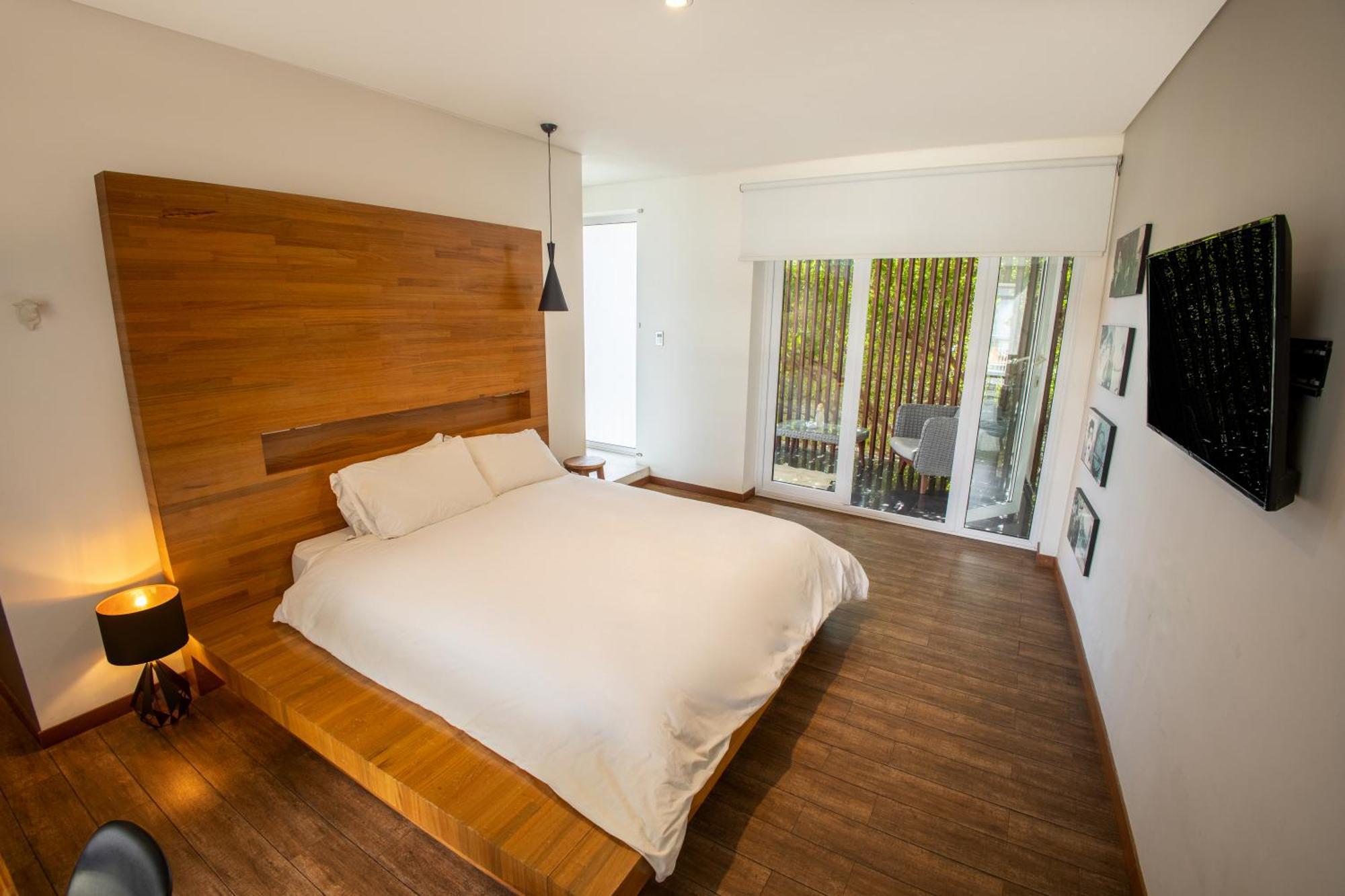 Cosmopolitano Hotel Boutique Santa Cruz de La Sierra Dış mekan fotoğraf A bedroom at the hotel